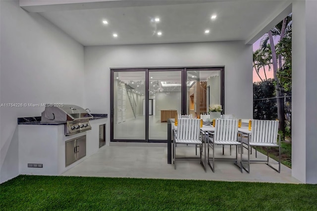 dining space featuring recessed lighting and concrete floors