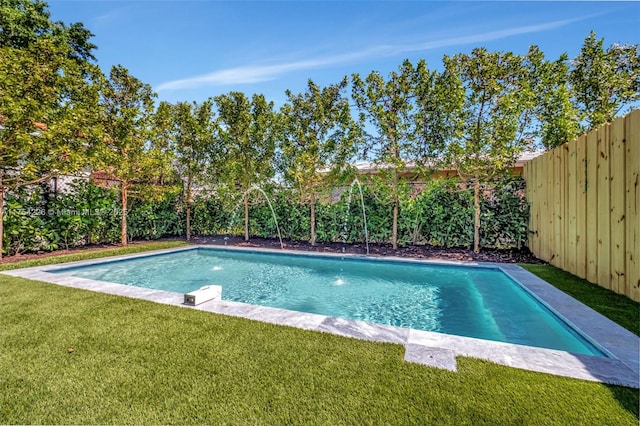 view of pool with a fenced backyard, a fenced in pool, and a yard