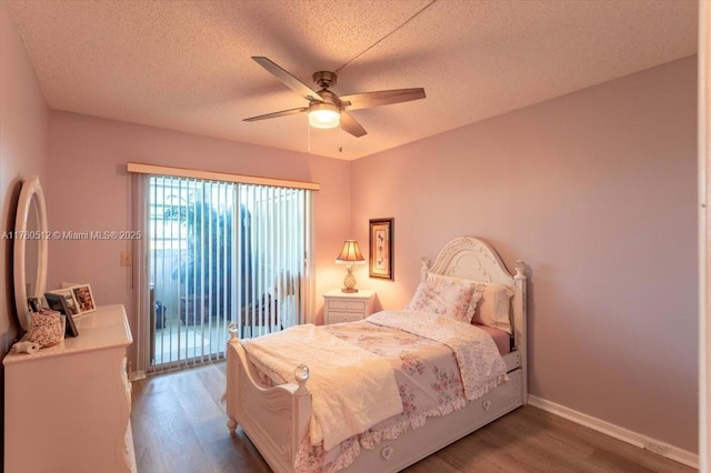 bedroom with a ceiling fan, wood finished floors, baseboards, access to exterior, and a textured ceiling