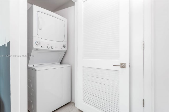 laundry room with laundry area and stacked washer and dryer