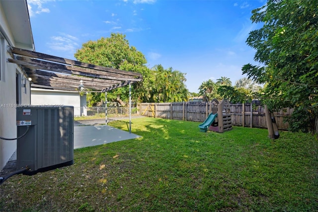 view of yard featuring central air condition unit, a fenced backyard, and a pergola