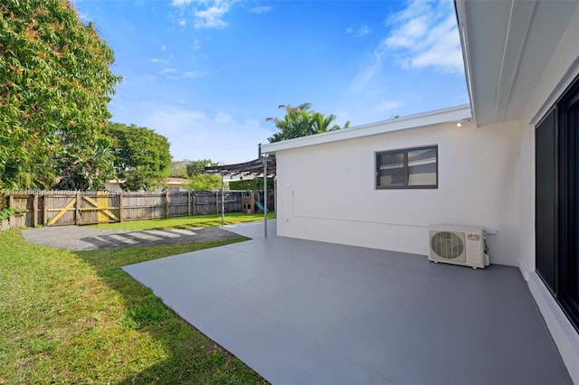 view of patio with a fenced backyard and ac unit