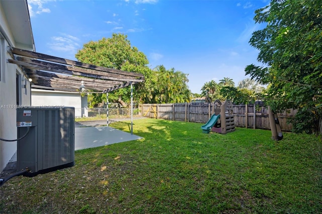 view of yard with a pergola, a fenced backyard, and cooling unit