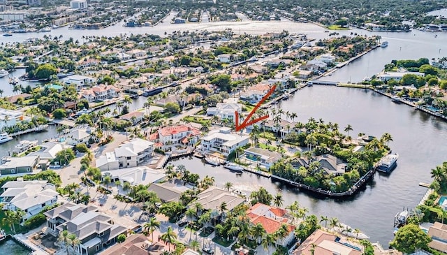 bird's eye view featuring a residential view and a water view