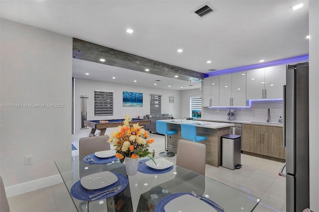 dining room featuring light tile patterned flooring, recessed lighting, visible vents, and baseboards