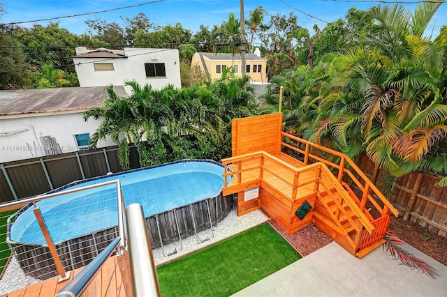 view of swimming pool with a fenced in pool and a fenced backyard