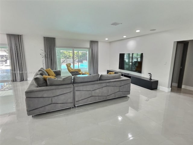 living room featuring visible vents, recessed lighting, and baseboards