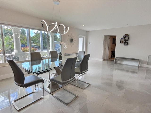 dining space featuring visible vents, baseboards, and a chandelier