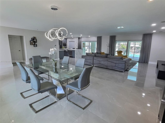 dining space with an inviting chandelier, recessed lighting, and baseboards