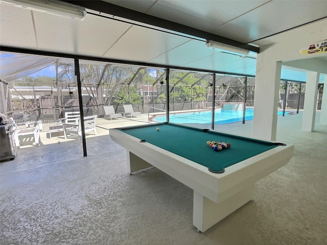 playroom with concrete floors, a healthy amount of sunlight, and pool table