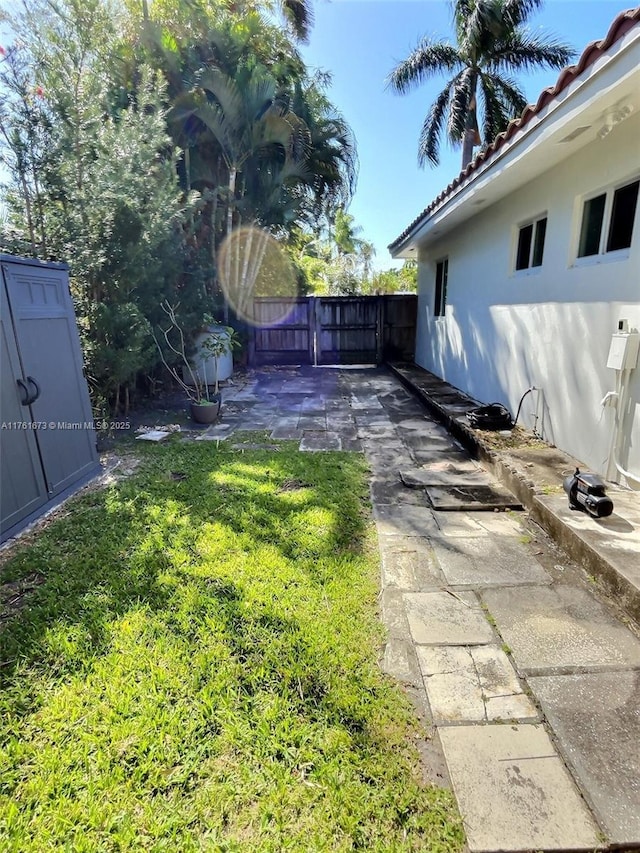 view of yard featuring a gate and fence