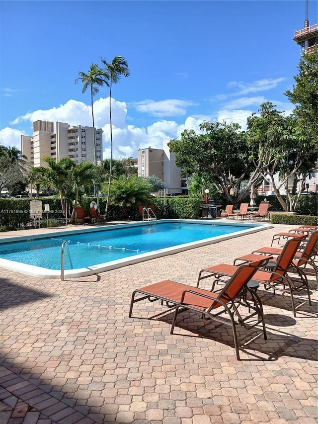 community pool featuring a patio