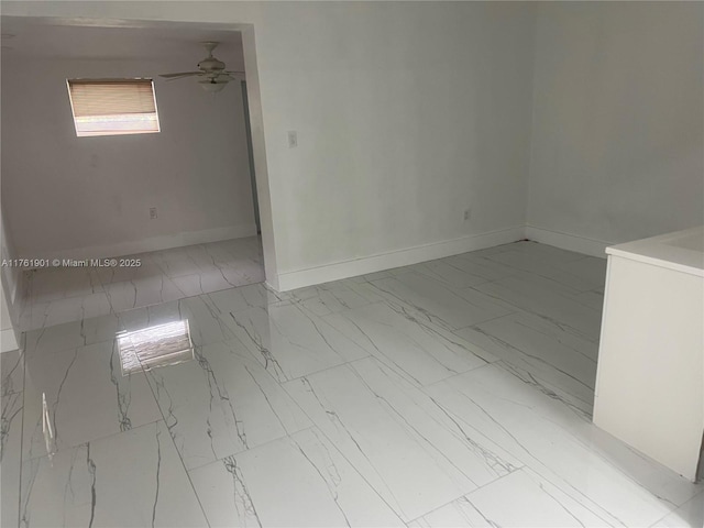 20 NE 215th St, Miami Gardens, FL 33179 - spare room featuring baseboards, a ceiling fan, and marble finish floor