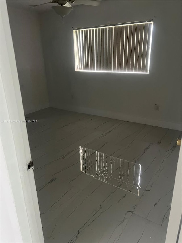 20 NE 215th St, Miami Gardens, FL 33179 - spare room with baseboards and a ceiling fan