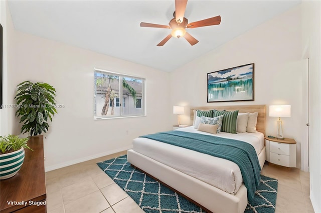 bedroom featuring ceiling fan, baseboards, lofted ceiling, and light tile patterned flooring