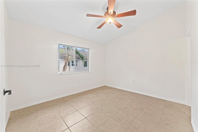 unfurnished room featuring lofted ceiling, light tile patterned flooring, a ceiling fan, and baseboards