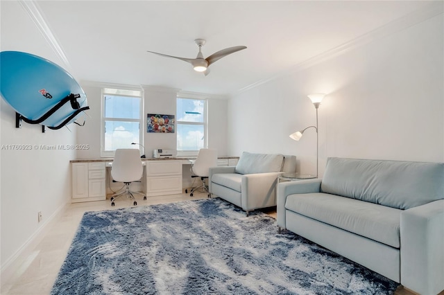 office area with baseboards, a ceiling fan, built in desk, and crown molding