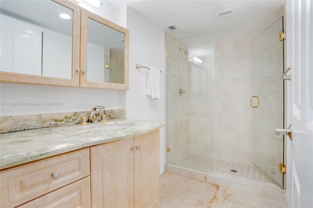 full bathroom with vanity, visible vents, and a stall shower