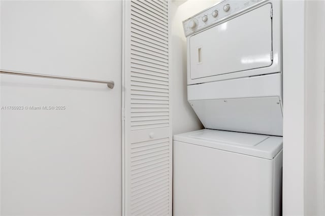 laundry room featuring laundry area and stacked washer and clothes dryer