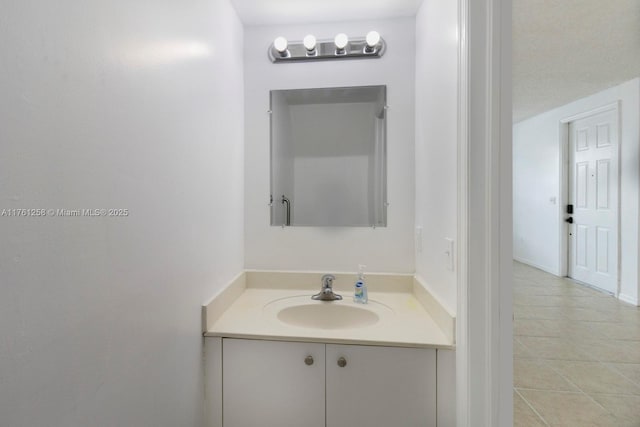 bathroom featuring tile patterned floors and vanity