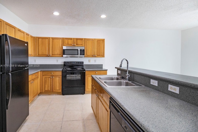 kitchen featuring black appliances, recessed lighting, light tile patterned flooring, a textured ceiling, and a sink