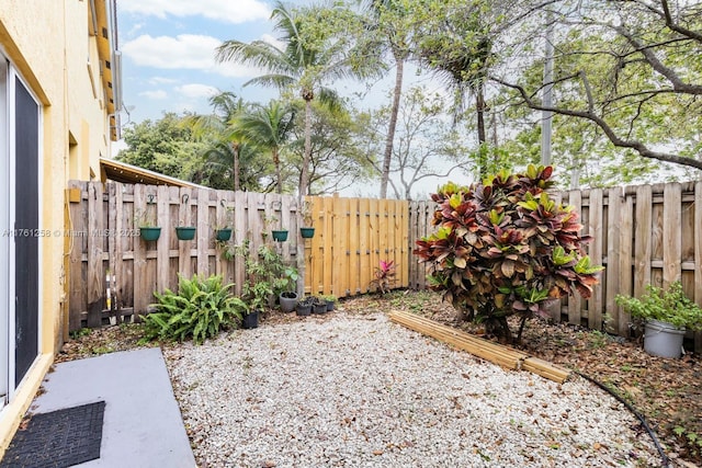 view of yard with a fenced backyard