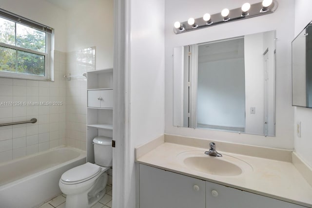 bathroom featuring tile patterned floors, toilet, vanity, and shower / tub combination