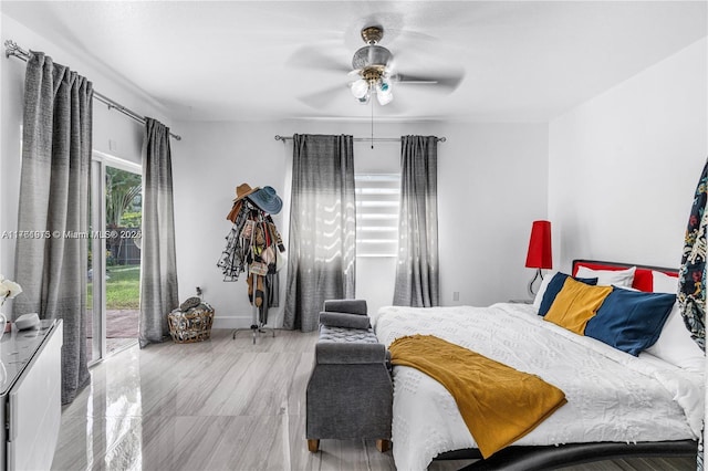 bedroom with access to exterior, baseboards, and ceiling fan