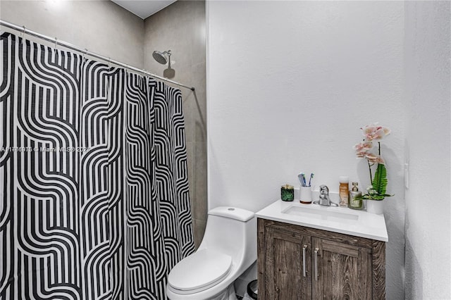 full bath featuring a shower, toilet, and vanity