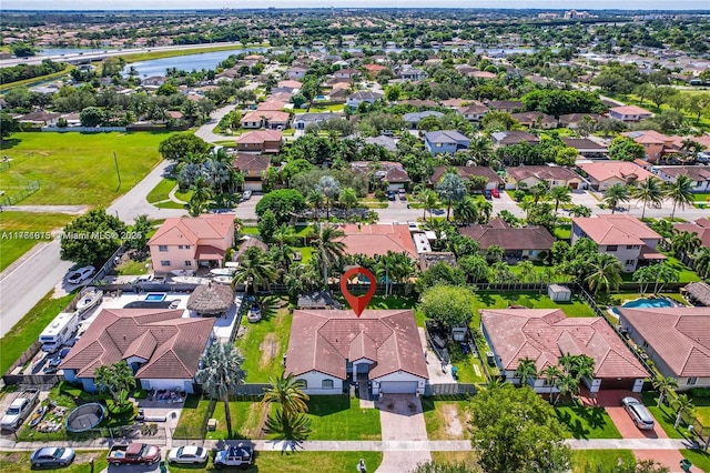 birds eye view of property featuring a residential view and a water view