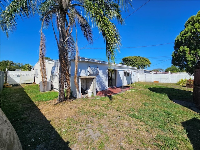 view of yard featuring cooling unit and a fenced backyard