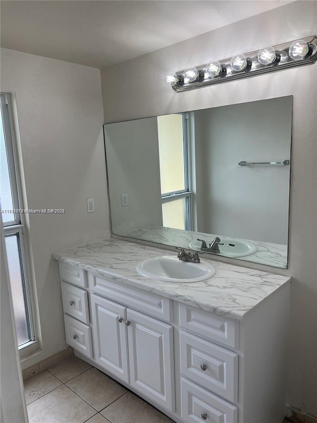 bathroom with tile patterned flooring and vanity