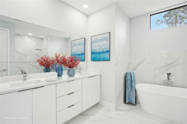 bathroom featuring a sink, marble finish floor, and double vanity