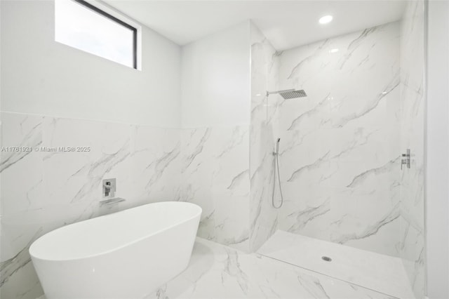 bathroom featuring a marble finish shower, a soaking tub, marble finish floor, and recessed lighting