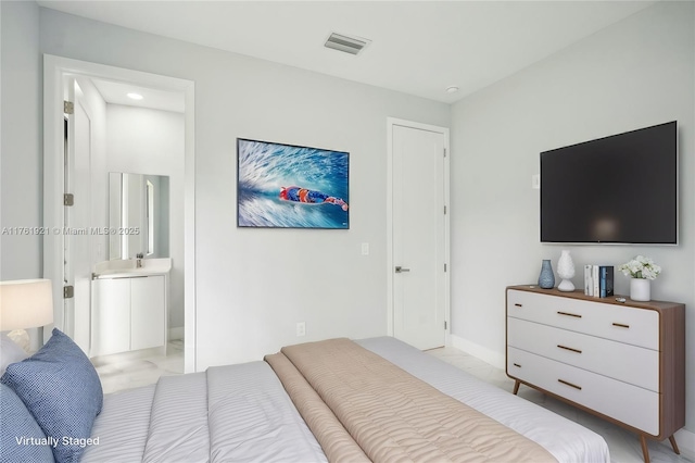 bedroom with ensuite bath, visible vents, and marble finish floor