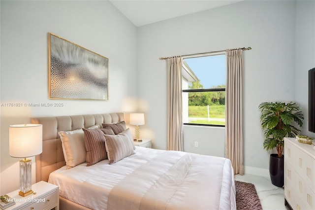 bedroom featuring baseboards and marble finish floor