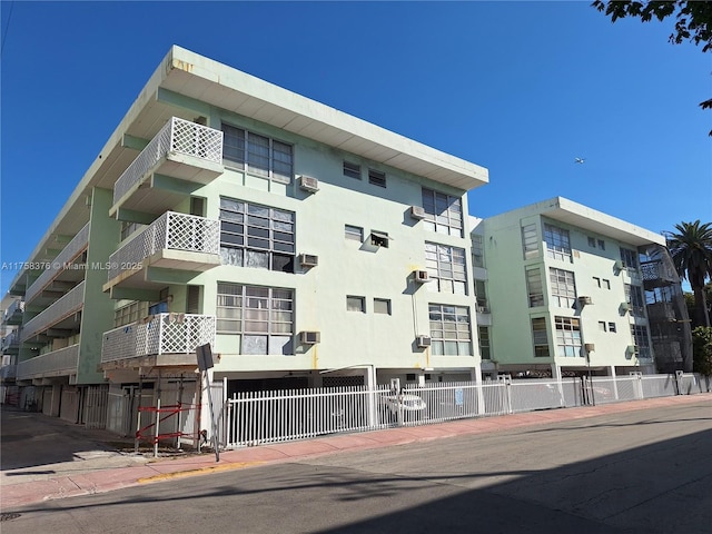 view of building exterior featuring fence