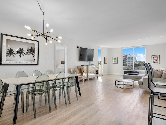 10350 W Bay Harbor Dr Unit 4H, Bay Harbor Islands, FL 33154 - dining area featuring baseboards, light wood-style floors, and a chandelier