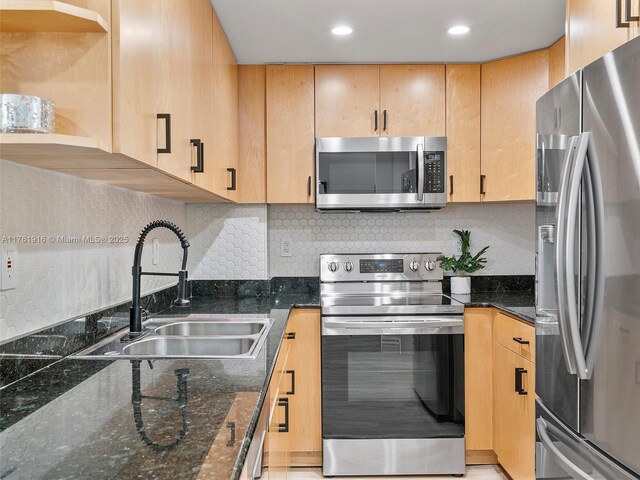 10350 W Bay Harbor Dr Unit 4H, Bay Harbor Islands, FL 33154 - kitchen featuring dark stone countertops, light brown cabinets, stainless steel appliances, and a sink