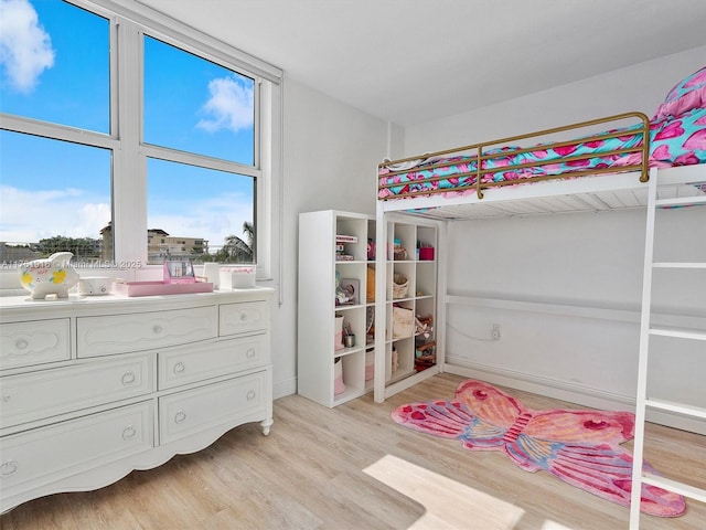 10350 W Bay Harbor Dr Unit 4H, Bay Harbor Islands, FL 33154 - bedroom featuring baseboards and light wood-type flooring