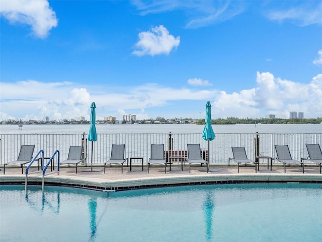 10350 W Bay Harbor Dr Unit 4H, Bay Harbor Islands, FL 33154 - pool featuring a patio and a water view