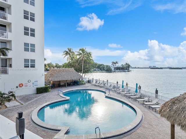 10350 W Bay Harbor Dr Unit 4H, Bay Harbor Islands, FL 33154 - pool with a water view and a patio area