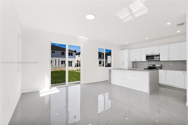 kitchen featuring a sink, modern cabinets, visible vents, and stainless steel appliances