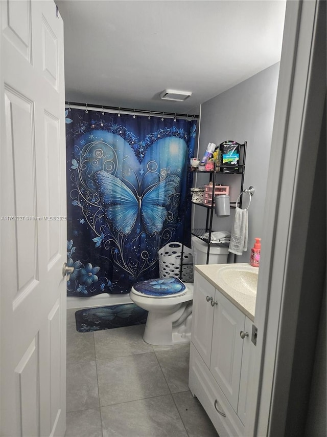 full bathroom with tile patterned flooring, toilet, vanity, and a shower with curtain