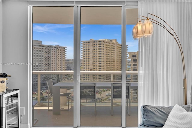 balcony featuring a city view and wine cooler