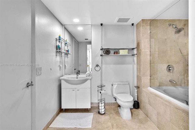 full bath with vanity, visible vents, tiled shower / bath combo, tile patterned floors, and toilet