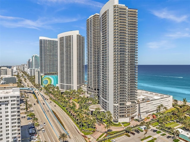 view of property with a city view and a water view