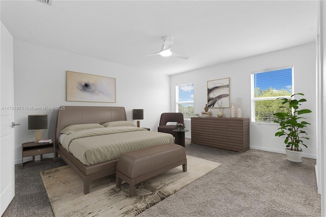 bedroom with carpet flooring, ceiling fan, and baseboards