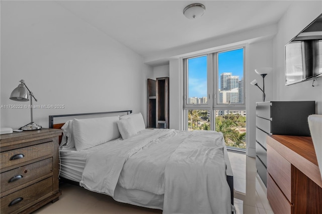 bedroom with light tile patterned flooring