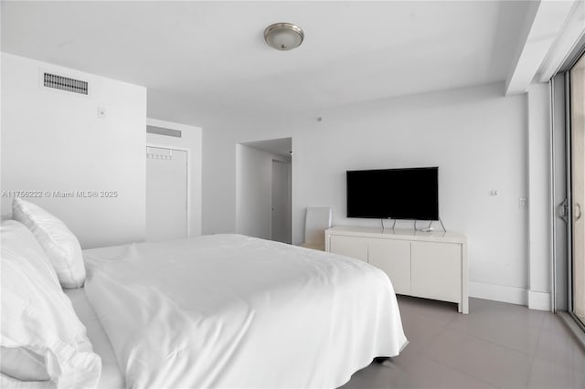 bedroom featuring visible vents and baseboards